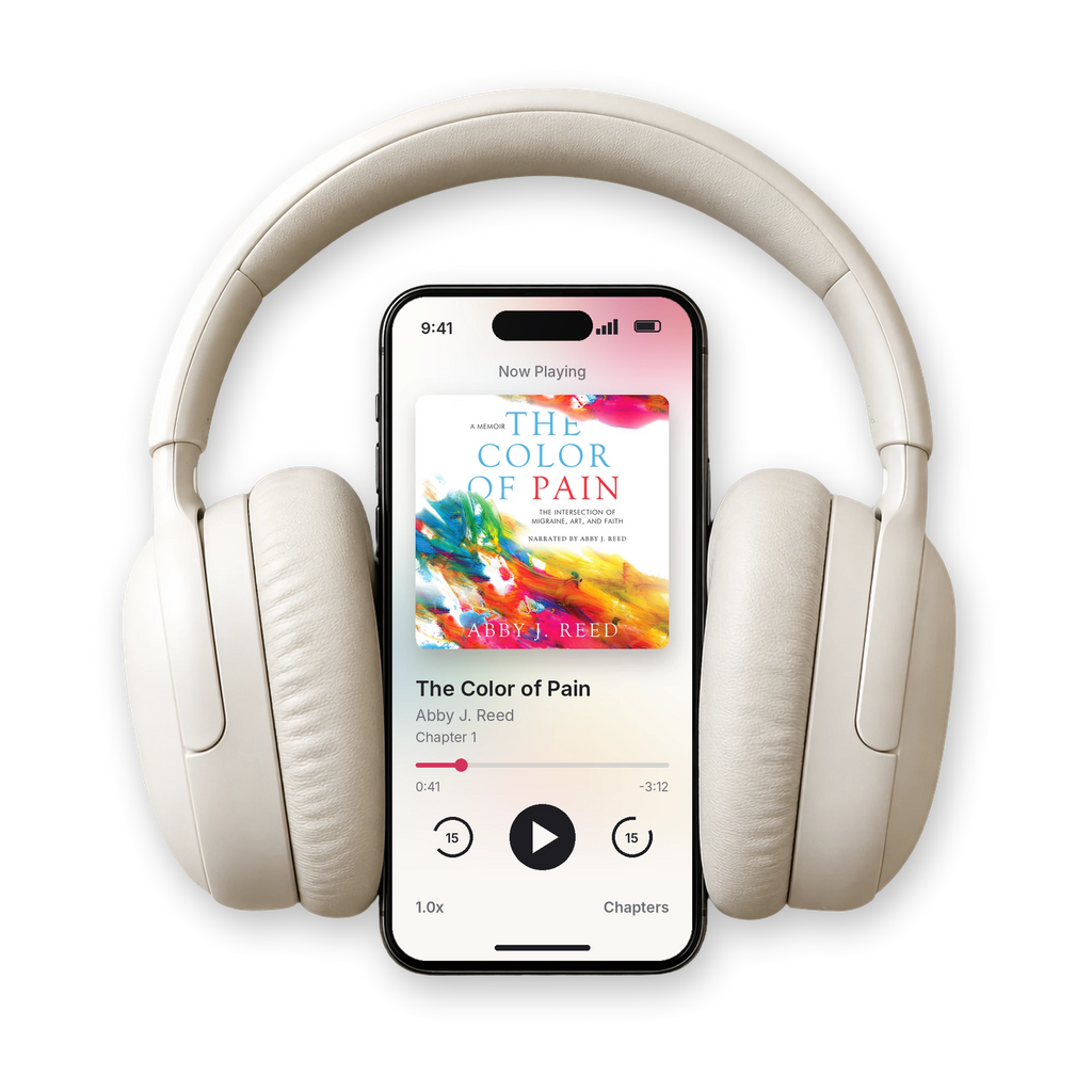 The Color of Pain audiobook by Abby J. Reed playing on a phone, with headphones